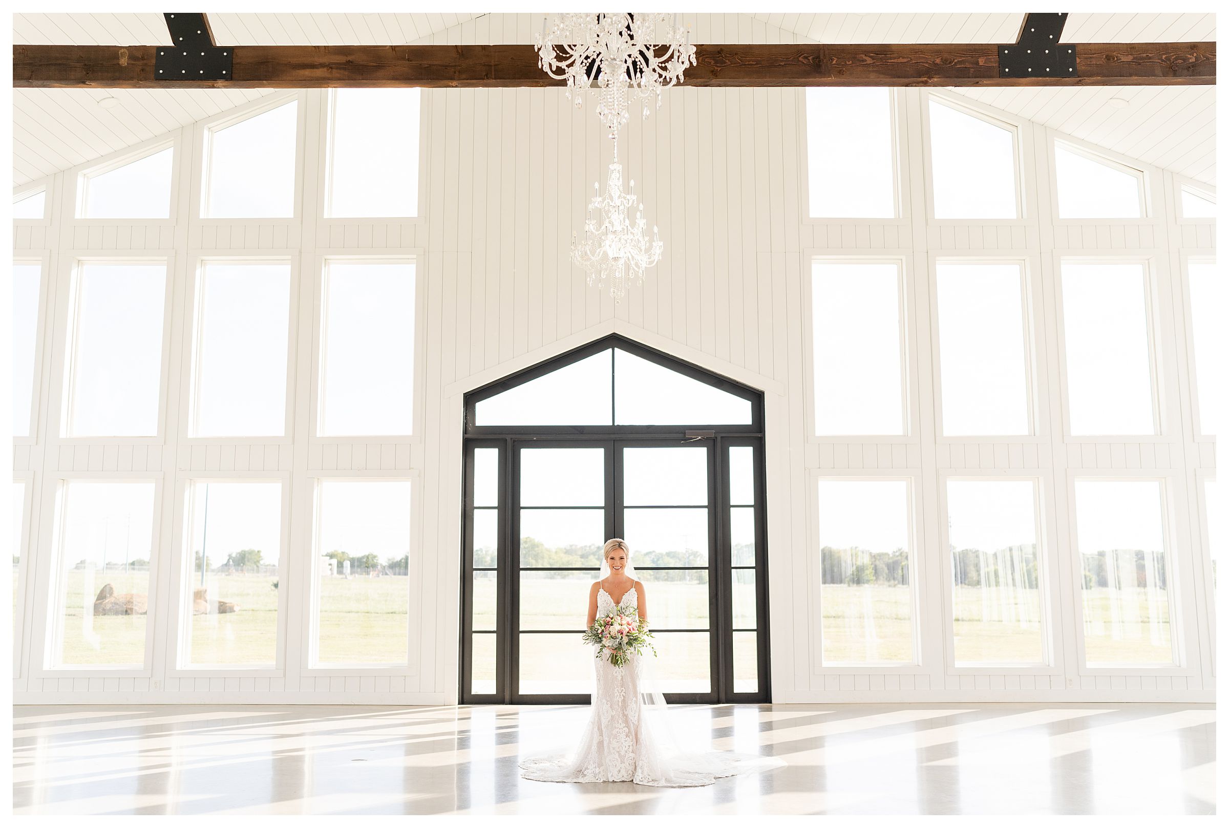 Bridal Session at The Ranch House in Texas, an all white Texas wedding venue with natural light and a wall of windows. Bride with bouquet, veil and wedding dress